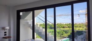 a view of a staircase from a house with windows at Penthouse in Cana Rock in Punta Cana +1 photo