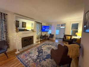 a living room with a couch and a fireplace at Old Florida Charm in Eustis