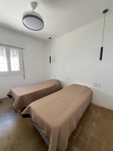 En eller flere senge i et værelse på La casita del Dante