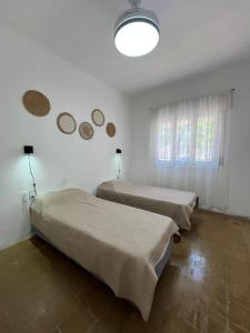 En eller flere senge i et værelse på La casita del Dante