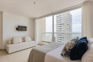 a bedroom with a bed and a large window at Eira: Luxury and Serenity by the Sea in Santa Marta in El Prado +121 photos