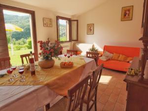 a living room with a table with wine glasses at Mansion in Apecchio with Pool in Apecchio