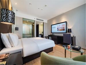 TV a/nebo společenská místnost v ubytování Orange Hotel Chengdu High-Tech Global Center