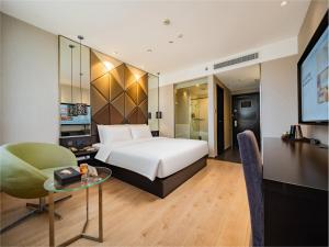 Postel nebo postele na pokoji v ubytování Orange Hotel Chengdu High-Tech Global Center