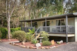 a small house with a porch at Awonga Cottages in Halls Gap