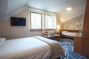 Posteľ alebo postele v izbe v ubytovaní Hotel Nad Nettą + 27 fotografií