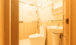 a bathroom with a toilet and a sink at RedDoorz at Emperor Manila Boutique Hotel in Manila +48 photos