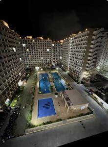 a view of a pool in a hotel at night at Cel Escapia in Lapu Lapu City +10 photos