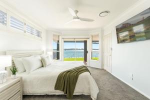 Ένα ή περισσότερα κρεβάτια σε δωμάτιο στο Dolphin View