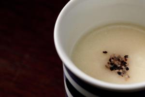 a white bowl of soup with a pile of cereal in it at Sui Suwako in Suwa +217 photos