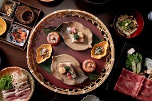 a table with a plate of food on it at Sui Suwako in Suwa