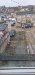 a view of a parking lot with cars parked at Cozy one bedroom flat in Chatham