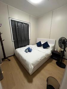 En eller flere senge i et værelse på Grace Mt Kinabalu Pods