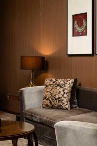 a living room with a couch and a table at Crowne Plaza Kunming City Centre by IHG in Kunming