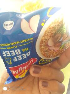 a person is holding a bag of noodles at Mike Saba 