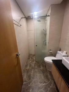a bathroom with a shower and a toilet and a sink at FLC Sea Tower QUY NHƠN-Codotel View Biển Quy Nhơn-Hồ Bơi-TT Thành Phố in Quy Nhon