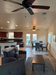 a living room with a couch and a table at Desert Vista View in Desert Hot Springs