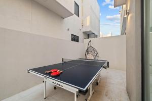 a ping pong table in the middle of a room at Playas de Tijuana in Tijuana