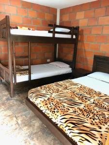 En eller flere senge i et værelse på Cabaña campestre