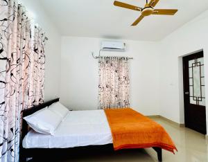 En eller flere senge i et værelse på Anandha Vibes