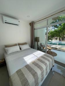 Postel nebo postele na pokoji v ubytování Sama Beach Resort by Munchies Resort + 121 fotografií