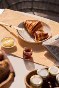 a table with a plate of food on a table at Mandarest Hsaa 32 in Ho Chi Minh City