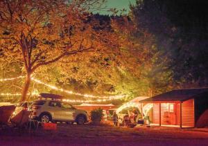 a car parked in front of a house with lights at Our Minano Base - Vacation STAY 92839v in Minano +8 photos