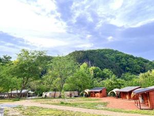 a group of buildings with a mountain in the background at Our Minano Base - Vacation STAY 92839v in Minano