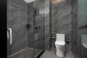 Ένα μπάνιο στο OKDAY Hotel Hengyang Nanhua University Jiefang Xi Road