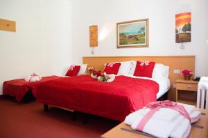 Rúm í herbergi á GH Hotel Piaz