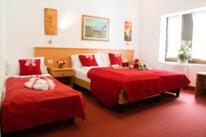 Rúm í herbergi á GH Hotel Piaz