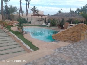 Πισίνα στο ή κοντά στο Villa sunbeach Djerba avec piscine privée
