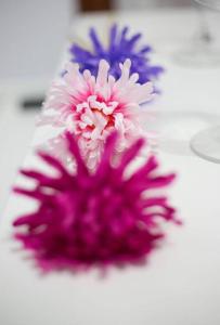 a purple flower sitting on a white table at Apartamento Almendra BAJO in Ronda