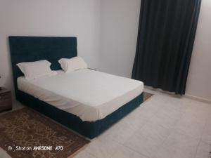 Ένα ή περισσότερα κρεβάτια σε δωμάτιο στο Villa sunbeach Djerba avec piscine privée