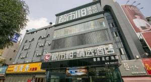 a building with chinese writing on the side of it at City 118 Selected Hotel Tengzhou Railway Station in Tengzhou