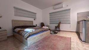 Postel nebo postele na pokoji v ubytování גבעת האלון