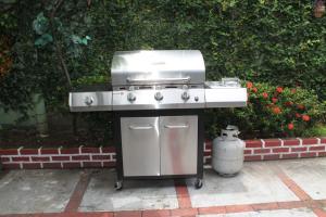 a grill sitting on a patio with aperature at Hostal Cocos Inn in Panama City