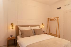 En eller flere senge i et værelse på Kazimierz Residence Apartments by Staymoovers