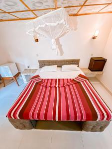 Ένα ή περισσότερα κρεβάτια σε δωμάτιο στο Anu Villa Wadduwa