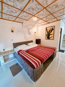 Ένα ή περισσότερα κρεβάτια σε δωμάτιο στο Anu Villa Wadduwa