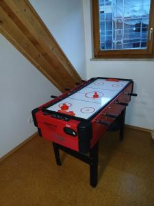 a ping pong table in the corner of a room at Ferienhaus Plech in Plech +19 photos