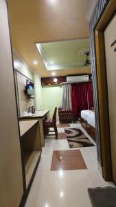 a room with a kitchen and a living room at Hotel Gokul Plaza Near Railway Station Bhubaneswar in Bhubaneshwar +22 photos