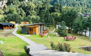 a small house on a hill with a garden at The Himalayan Phakding in Phakding +6 photos