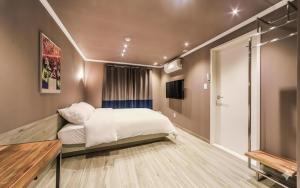 Ένα ή περισσότερα κρεβάτια σε δωμάτιο στο Tinto Hotel