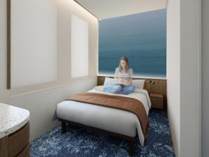 Ένα ή περισσότερα κρεβάτια σε δωμάτιο στο The OneFive Tokyo Kameido