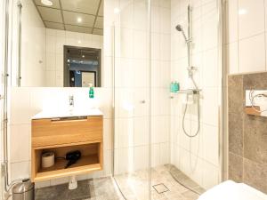 a bathroom with a sink and a shower at Stötens Stugor & Lägenheter in Stöten +37 photos