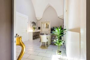 a living room with a table and chairs at B&B Centro Storico Lecce in Lecce