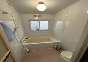 a bathroom with a shower and a sink and a toilet at Ota Apartment - Vacation STAY 16060 in Otaru