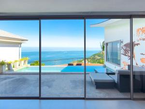 a villa with a view of the ocean from a house at Staylar Seaview Pool Villa Gina Chaweng Noi in Bophut 
