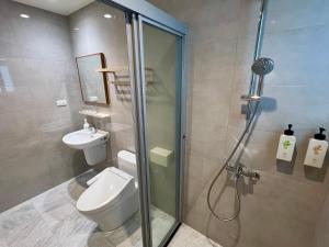 a bathroom with a shower and a toilet and a sink at 靜沐森林 in Dongshan +29 photos